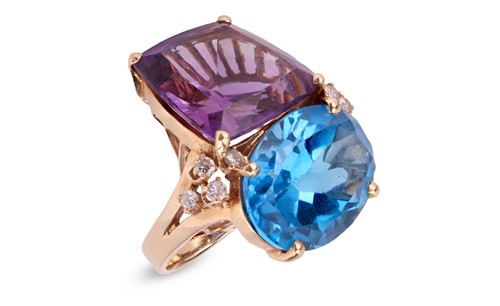 Lot 138 - A large amethyst and topaz cocktail ring,...