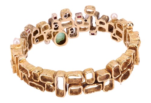 Lot 56 - A Modernist multi-gem bangle, designed by Karl...