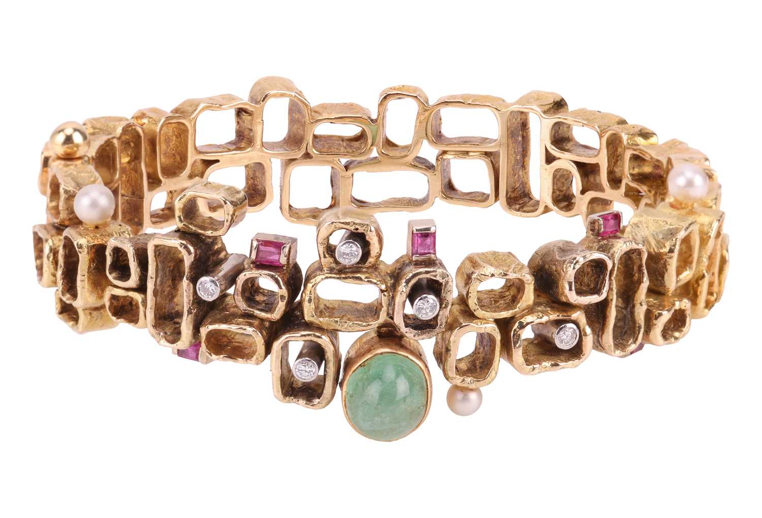 Lot 56 - A Modernist multi-gem bangle, designed by Karl...