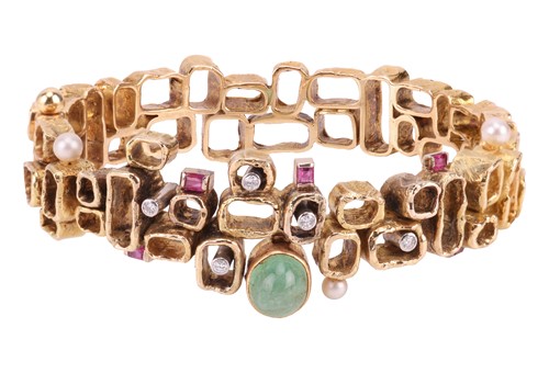 Lot 56 - A Modernist multi-gem bangle, designed by Karl...