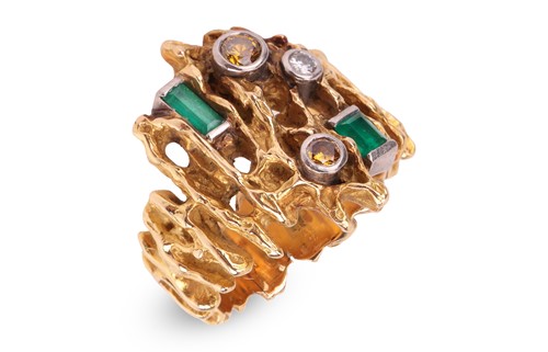 Lot 55 - A modernist dress ring set with emerald and...