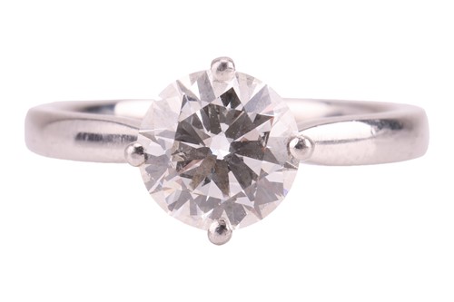 Lot 146 - A diamond solitaire ring in platinum, claw-set...