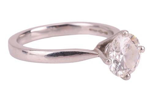 Lot 146 - A diamond solitaire ring in platinum, claw-set...
