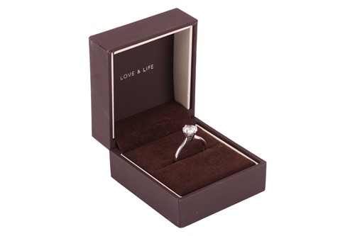 Lot 146 - A diamond solitaire ring in platinum, claw-set...