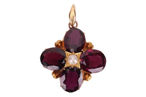 Lot 20 - An Edwardian garnet and pearl floral pendant,...