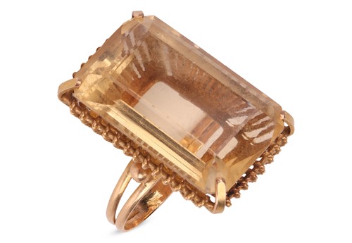 Lot 77 - A large citrine ring, featuring a large...