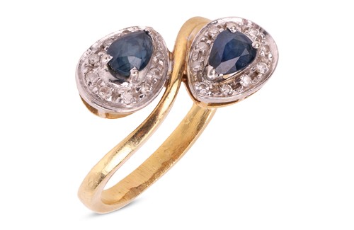 Lot 180 - A sapphire and diamond crossover ring,...
