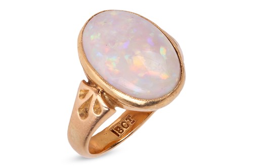 Lot 187 - An opal dress ring, the oval precious opal...