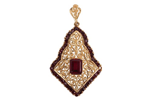 Lot 94 - A gem-set arabesque pendant, consisting of an...
