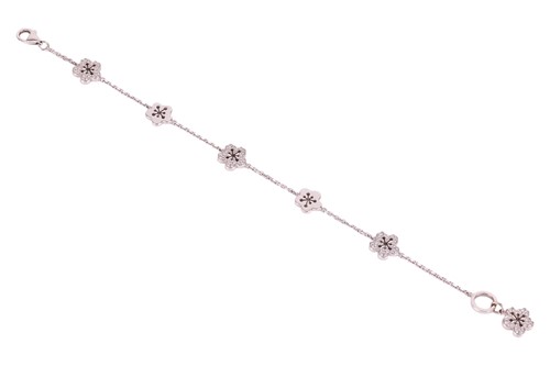 Lot 239 - Boodles - a diamond-set 'Blossom' charm...