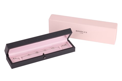 Lot 239 - Boodles - a diamond-set 'Blossom' charm...