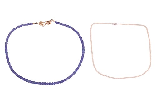 Lot 34 - Two strands of beaded necklaces; to include a...