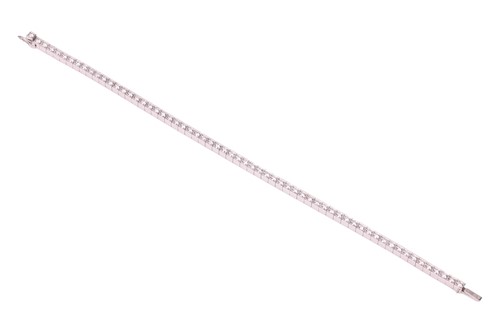Lot 232 - Cartier - a Lanière diamond line bracelet in...