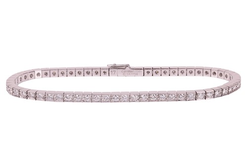 Lot 232 - Cartier - a Lanière diamond line bracelet in...
