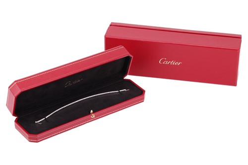Lot 232 - Cartier - a Lanière diamond line bracelet in...