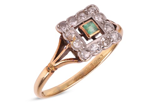 Lot 28 - An emerald and diamond dress ring; centred...
