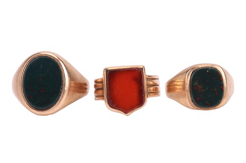 Lot 31 - Three signet rings; the first set with an oval...