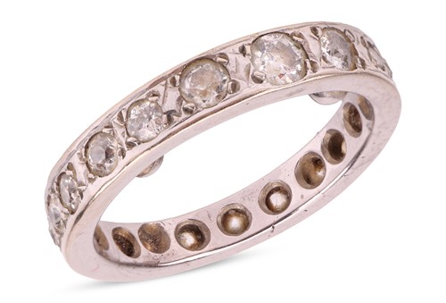 Lot 17 - A diamond-set full eternity ring, grain-set...