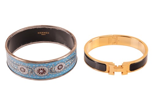 Lot 36 - Hermès - a narrow 'Clic H' bracelet with black...