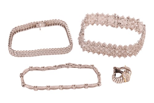 Lot 18 - A group of three diamond-set bracelets and a...