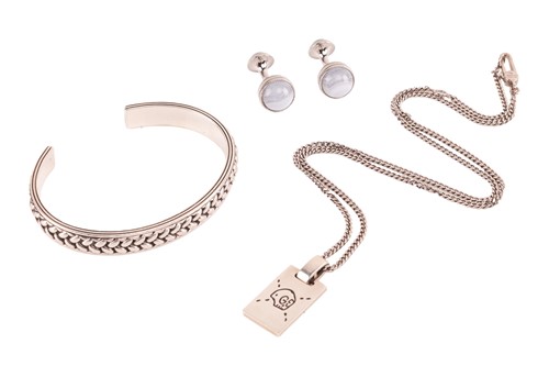 Lot 112 - A Gucci ghost skull silver pendant on chain, a...