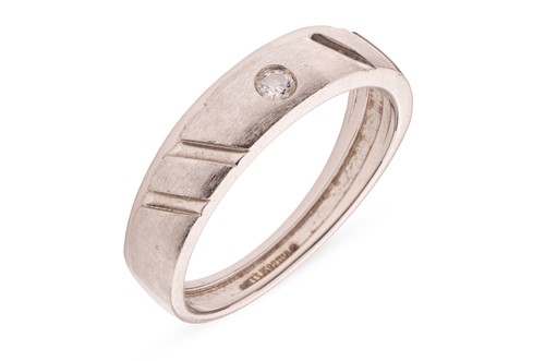 Lot 19 - A diamond-set band, featuring a gypsy-set...