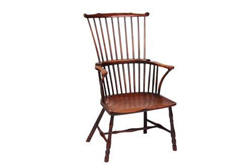 Lot 19 - A 19th century ash and elm comb back armchair,...