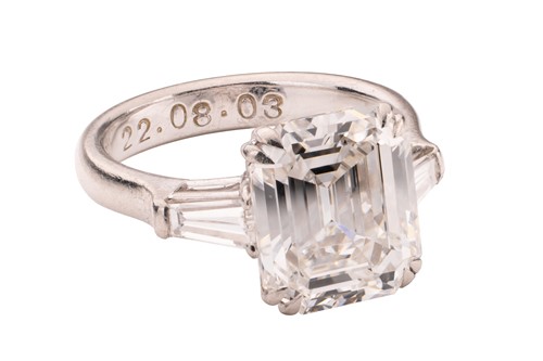 Lot 182 - An emerald-cut diamond solitaire ring, the...