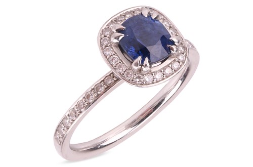 Lot 137 - A sapphire & diamond cluster ring by Pravins,...