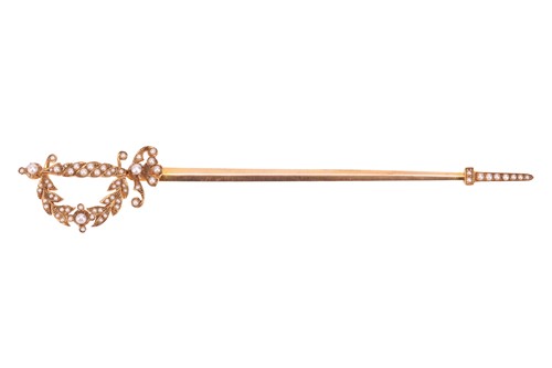Lot 29 - An early 20th Century seed pearl jabot pin, in...