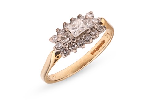 Lot 47 - A diamond-set cluster ring, featuring three...