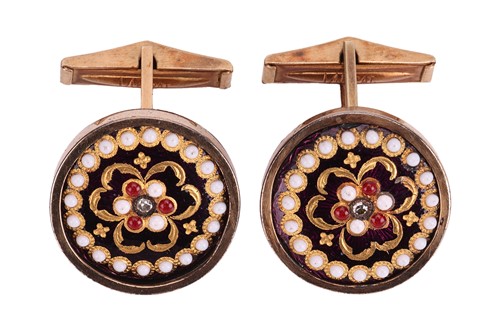 Lot 1 - A pair of diamond and enamel cufflinks in gilt...