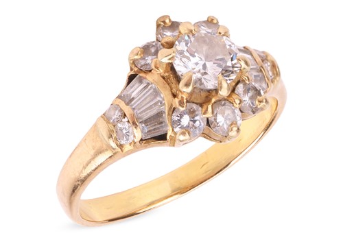 Lot 59 - A diamond-set cluster ring, the central round...