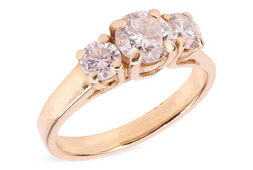 Lot 128 - A diamond-set three-stone ring, the central...