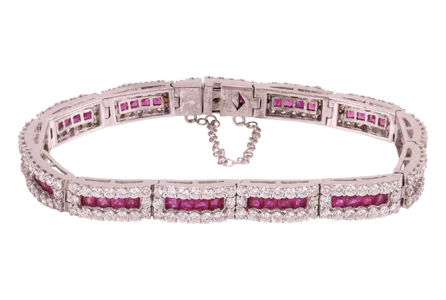 Lot 80 - A ruby and diamond line bracelet, each hinged...