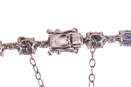Lot 113 - A sapphire and diamond line bracelet,...