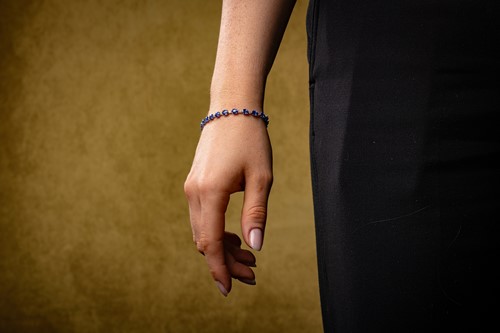 Lot 113 - A sapphire and diamond line bracelet,...