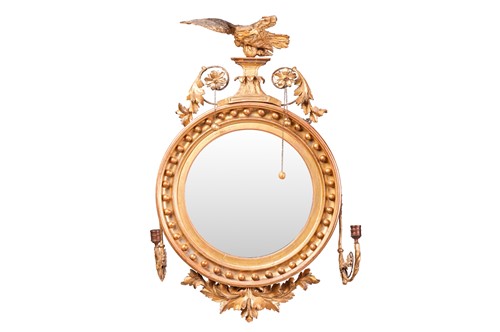 Lot 97 - A 19th-century giltwood convex mirror, with...