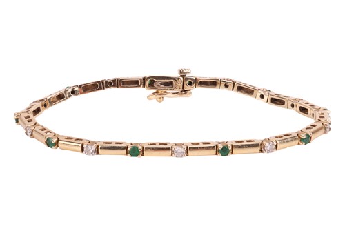 Lot 173 - A diamond and emerald line bracelet, the...