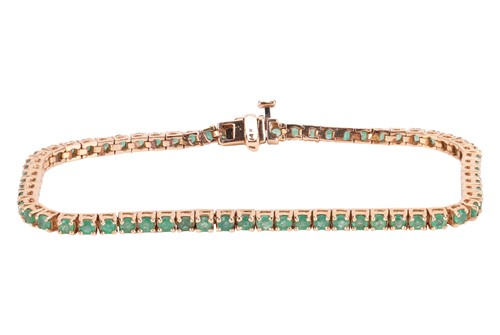Lot 60 - An emerald line bracelet, comprising a single...