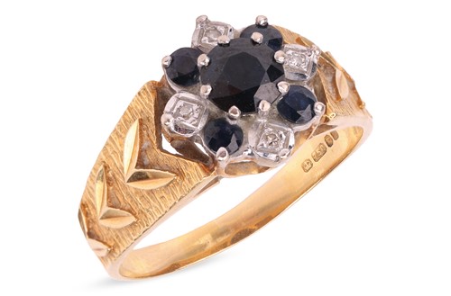 Lot 118 - A sapphire and diamond cluster ring in 18ct...