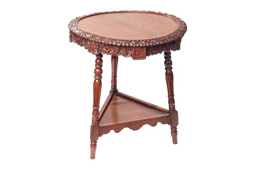 Lot 79 - An early 20th-century Scottish oak circular...