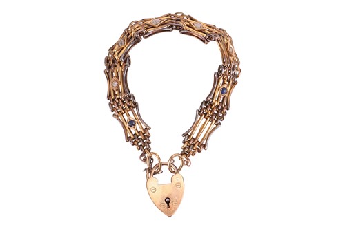 Lot 19 - A gem-set gate link bracelet with heart...