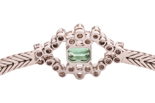 Lot 176 - An emerald and diamond-set cluster bracelet,...