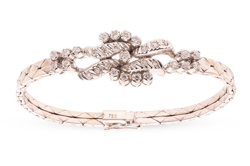 Lot 177 - A diamond-set foliate ensemble containing a...