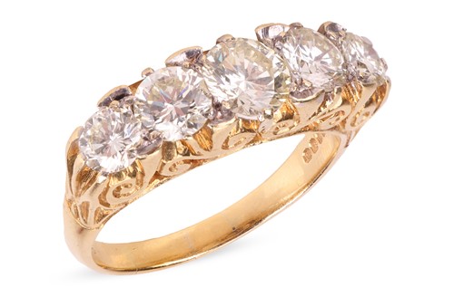Lot 16 - A diamond-set half hoop ring, set with five...