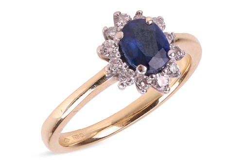 Lot 135 - A sapphire and diamond-set ring, centrally-set...