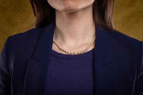 Lot 27 - An Edwardian natural saltwater pearl necklace,...