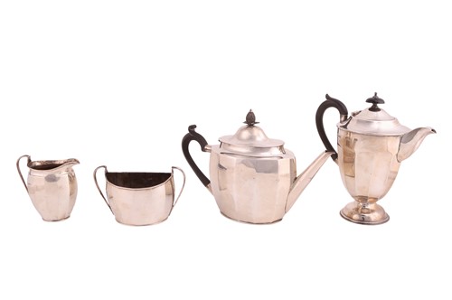 Lot 291 - A silver three-piece tea set with a matched...