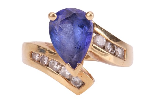 Lot 116 - A tanzanite and diamond crossover ring,...